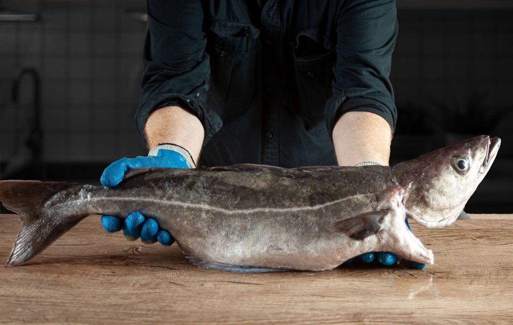 A fishmonger holding a fish