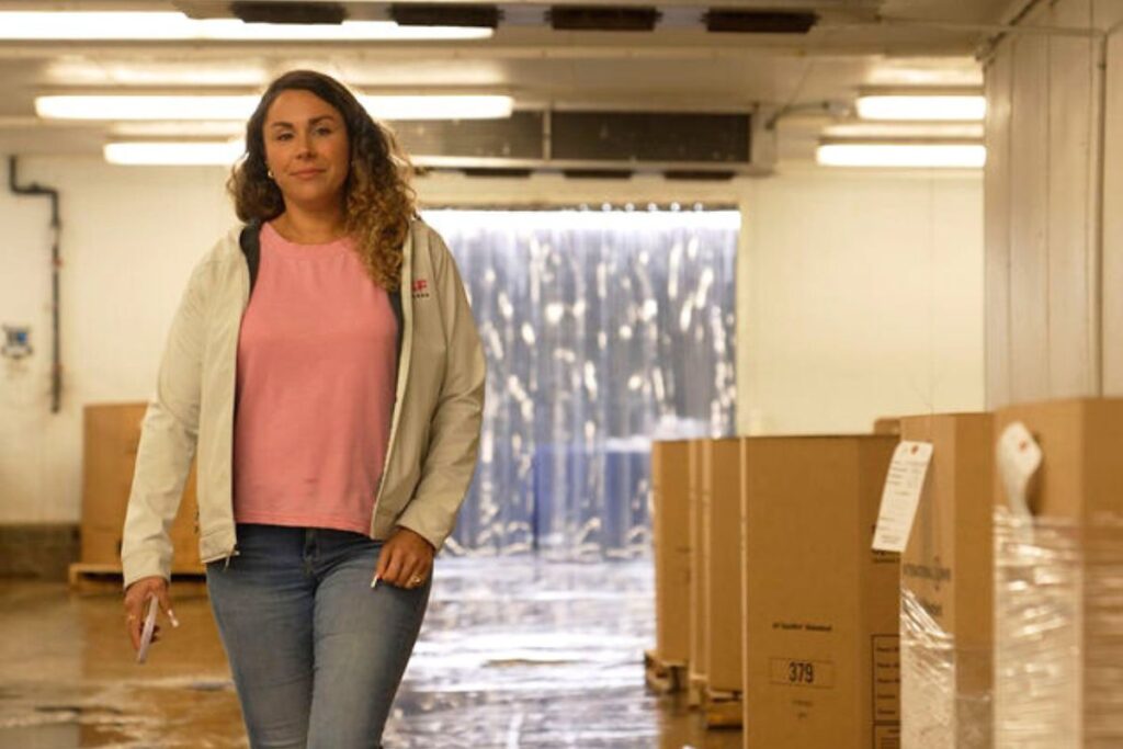 Cassie Canastra walking through a warehouse