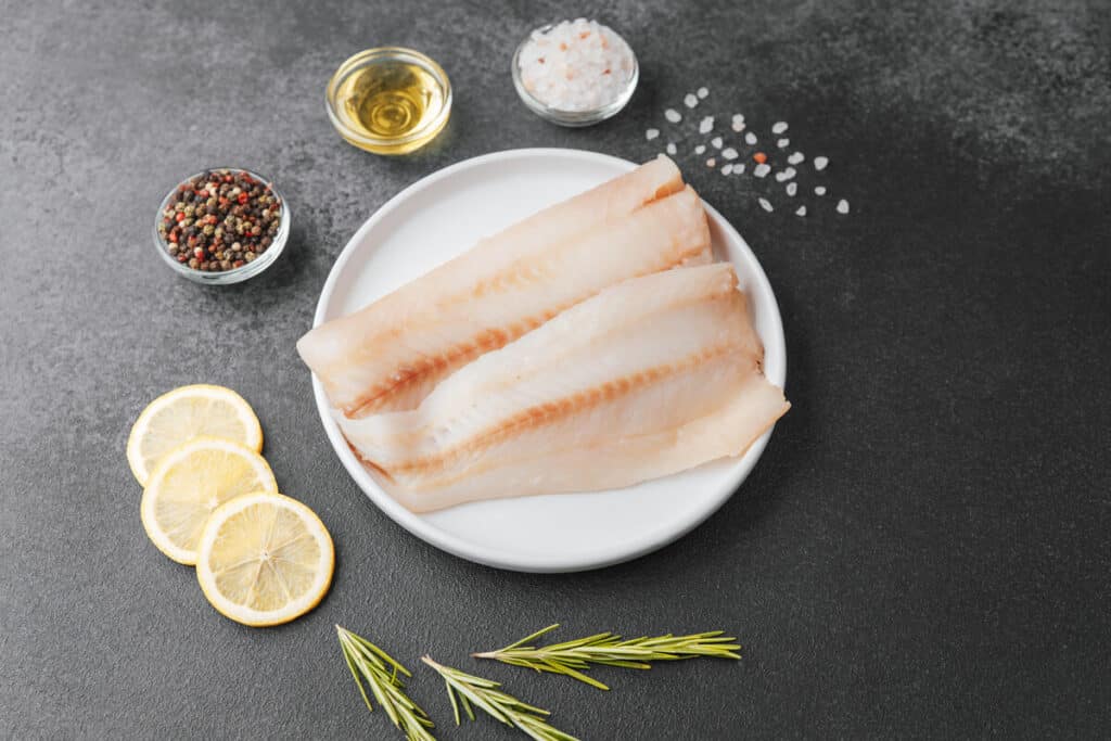 Pollock fillet with spices, lemon and rosemary