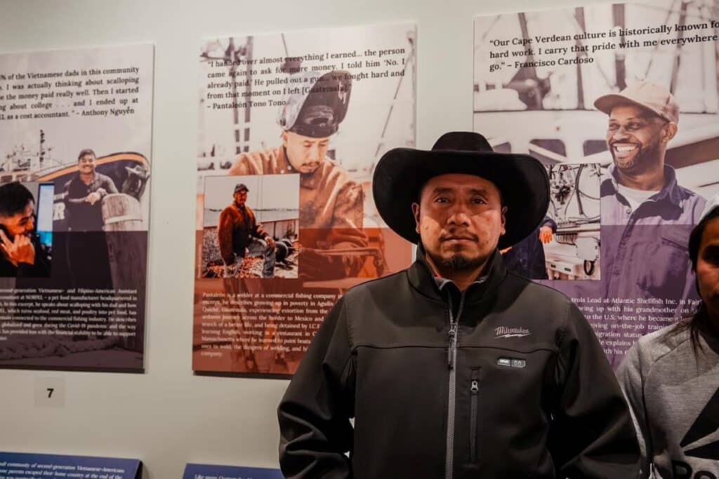 Man standing in front of museum display